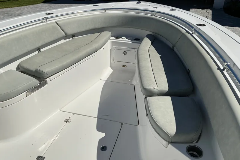 Slide: The Image of 2019 Sportsman Open 312 Center Console boat interior with cushioned seating. - 37