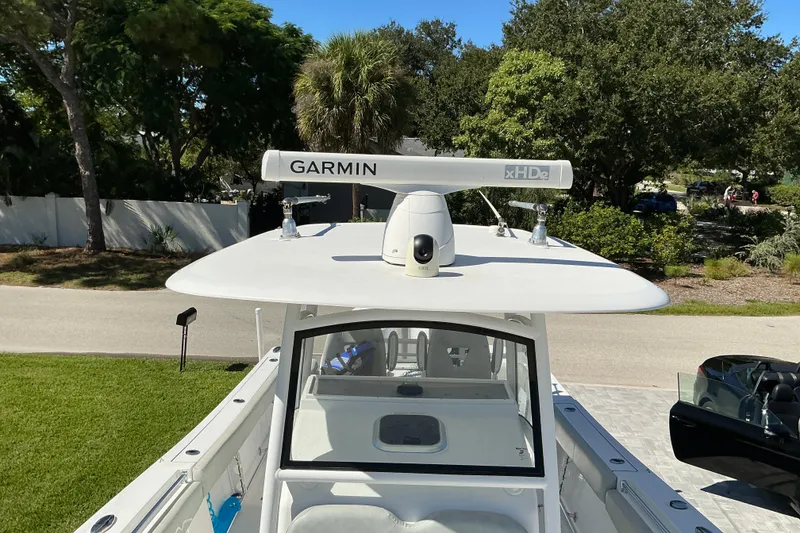 Slide: The Image of 2019 Sportsman Open 312 Center Console with Garmin radar, parked outdoors. - 27