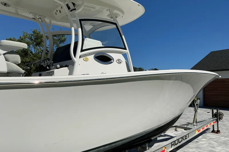 Slide: The Image of 2019 Sportsman Open 312 Center Console boat on trailer, side view. - 13