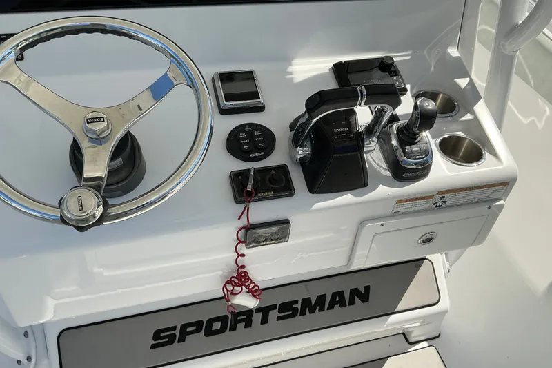 Slide: The Image of 2019 Sportsman Open 312 Center Console helm with steering wheel and controls. - 23