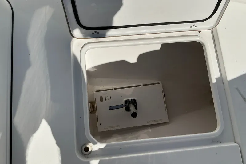 Slide: The Image of Open storage compartment on 2019 Sportsman Open 312 Center Console boat. - 33