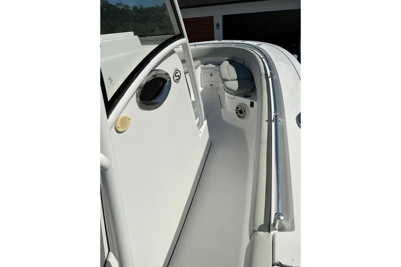 Slide: The Image of 2019 Sportsman Open 312 Center Console boat interior with seating and speaker. - 36