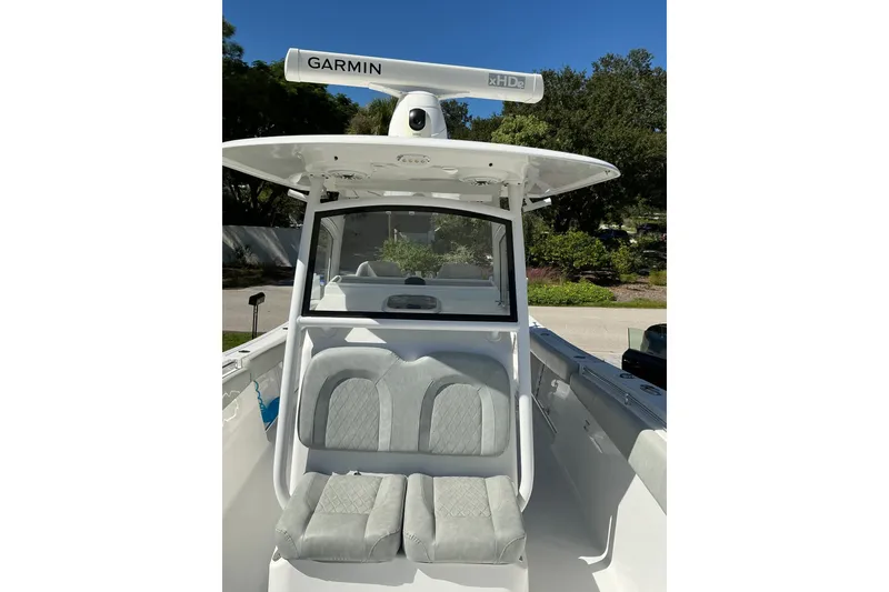 Slide: The Image of 2019 Sportsman Open 312 Center Console boat with Garmin radar, front seating view. - 31