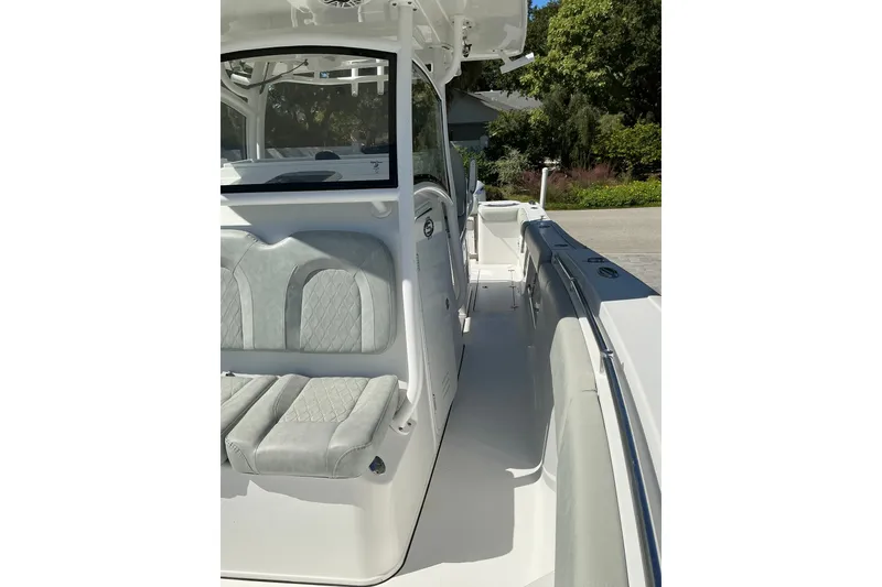 Slide: The Image of 2019 Sportsman Open 312 Center Console boat interior with cushioned seating. - 38