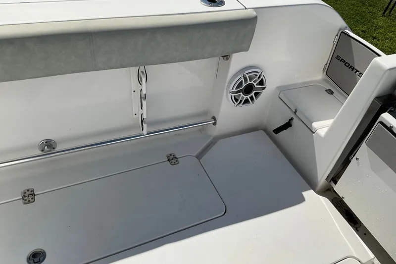 Slide: The Image of 2019 Sportsman Open 312 Center Console boat interior with seating and speaker. - 59