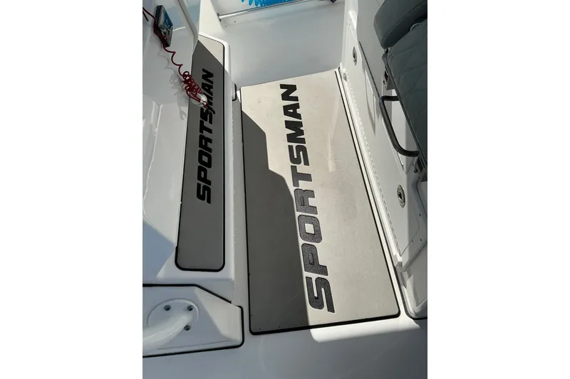 Slide: The Image of 2019 Sportsman Open 312 Center Console boat interior with branded flooring mats. - 42
