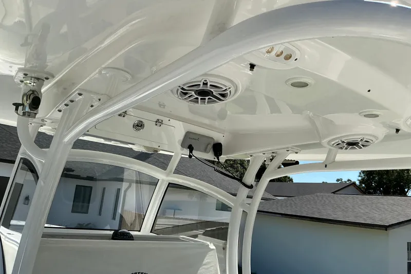 Slide: The Image of 2019 Sportsman Open 312 Center Console boat with speakers and electronics on the T-top. - 53