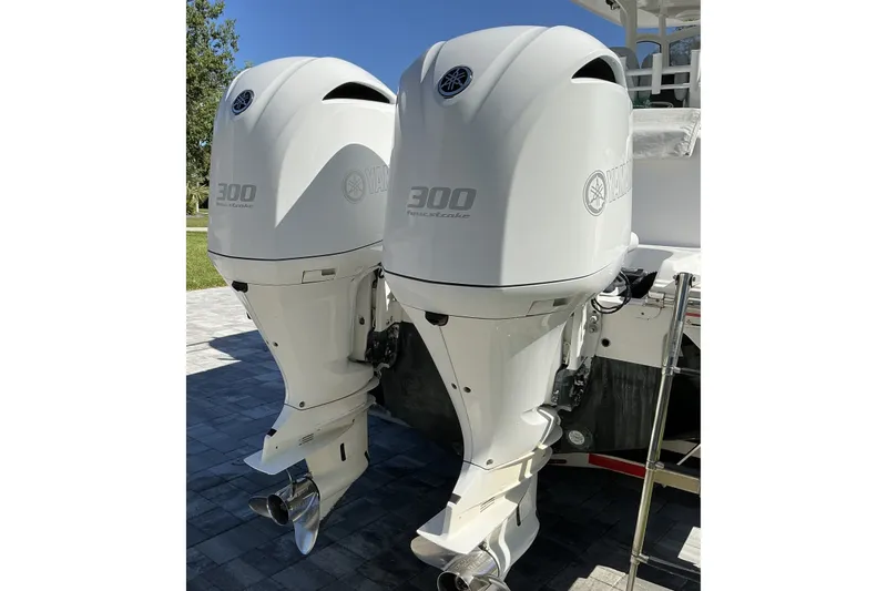 Slide: The Image of Twin Yamaha 300 outboard engines on a 2019 Sportsman Open 312 Center Console boat. - 19