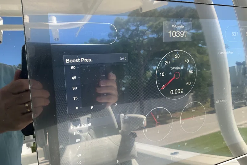 Slide: The Image of Dashboard of 2019 Sportsman Open 312 Center Console showing GPS speed and boost pressure. - 22