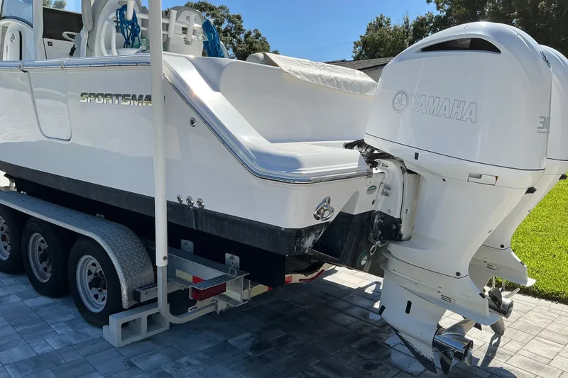 Slide: The Image of 2019 Sportsman Open 312 Center Console boat with twin Yamaha engines on a trailer. - 6