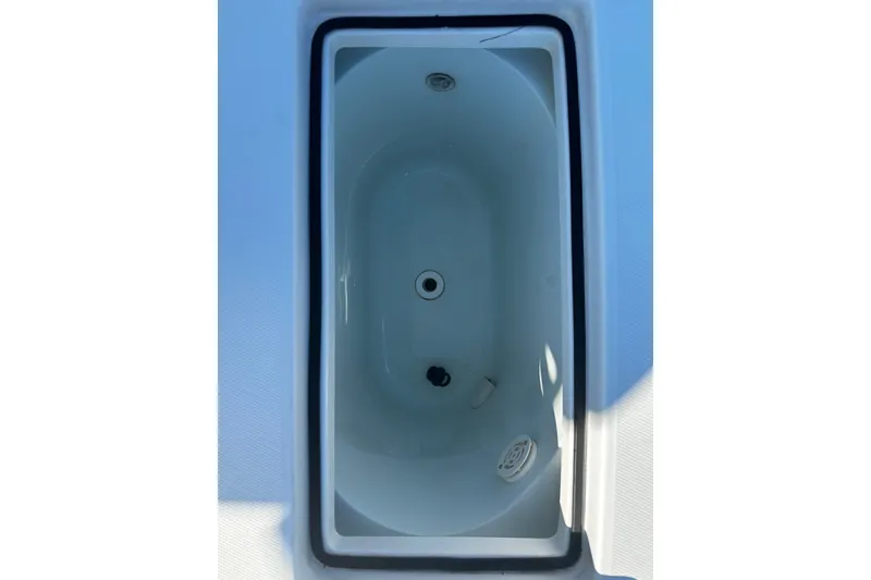 Slide: The Image of 2016 Regulator 28 Forward Seating boat storage compartment, top view. - 11