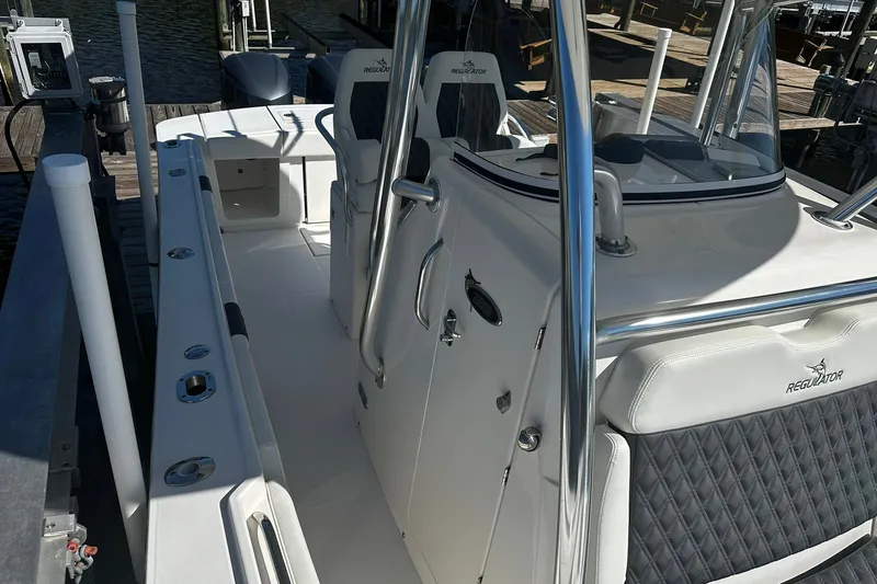 Slide: The Image of 2016 Regulator 28 Forward Seating boat interior with sleek design and comfortable seating. - 15