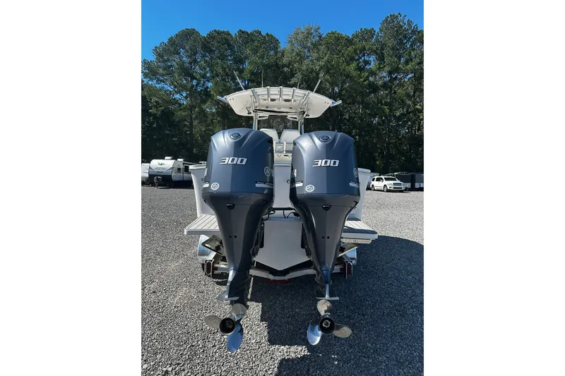 Slide: The Image of 2016 Regulator 28 Forward Seating boat with twin 300 horsepower engines. - 2