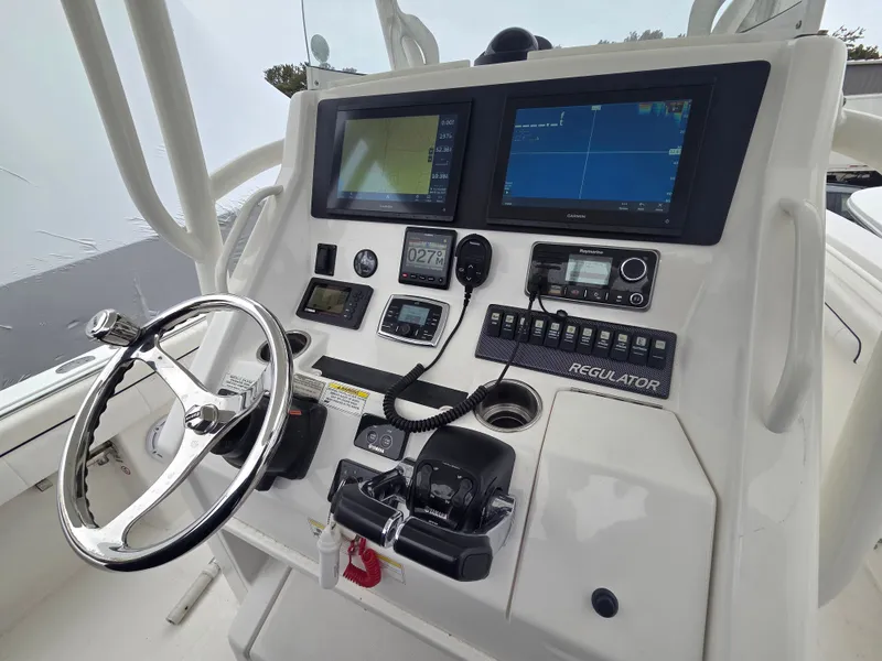 Slide: The Image of The cockpit of a 2016 Regulator FS with modern navigation systems and controls. - 4