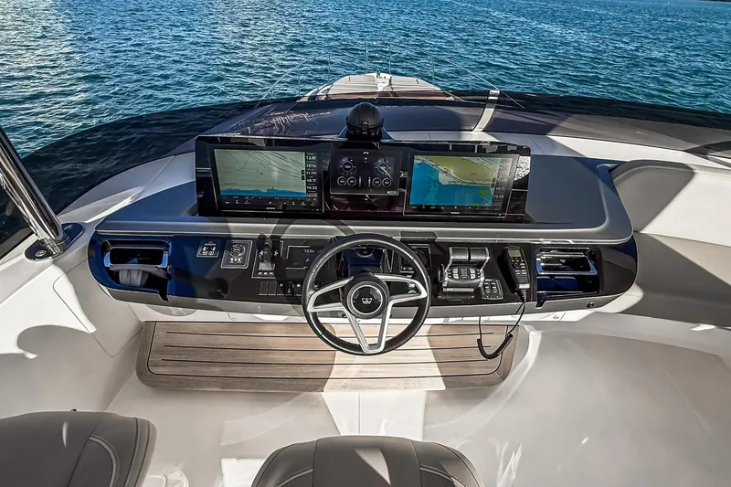 Slide: The Image of Helm of 2026 Princess S65 Sportbridge yacht with advanced navigation displays. - 95