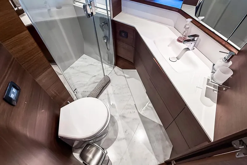Slide: The Image of Luxurious bathroom in 2026 Princess S65 Sportbridge yacht with modern fixtures and marble flooring. - 59