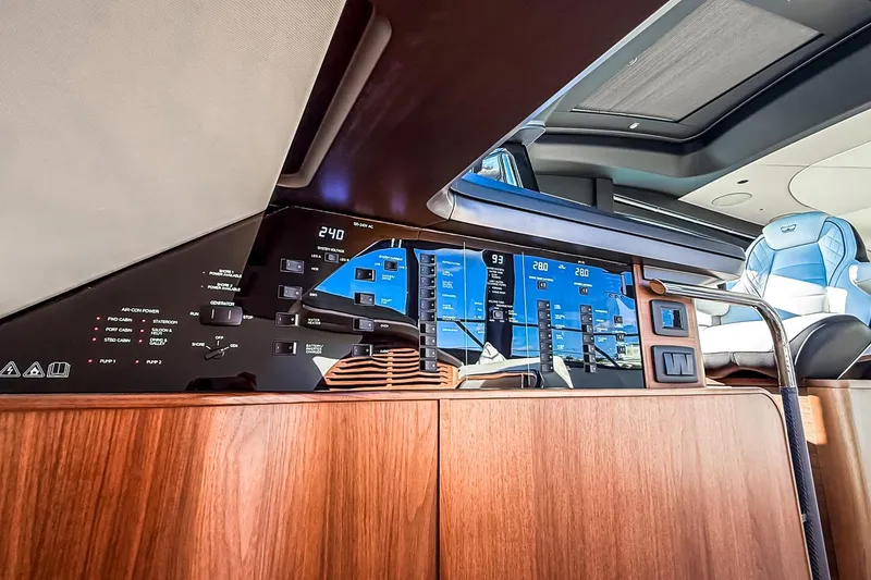 Slide: The Image of 2026 Princess S65 Sportbridge yacht interior with advanced control panel and luxurious seating. - 43