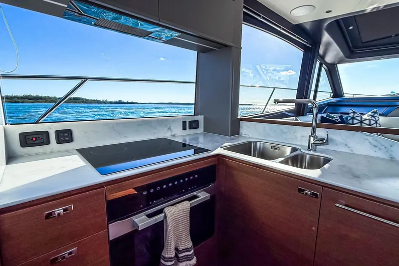 Slide: The Image of Luxurious kitchen interior of 2026 Princess S65 Sportbridge yacht with ocean view. - 25