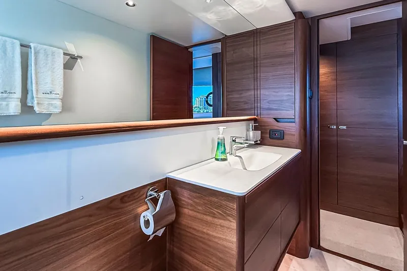 Slide: The Image of Luxurious bathroom interior of 2026 Princess S65 Sportbridge yacht with modern wood finishes. - 51