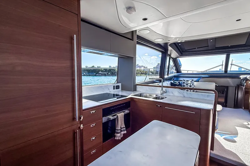Slide: The Image of Luxurious interior of 2026 Princess S65 Sportbridge yacht with modern kitchen design. - 22