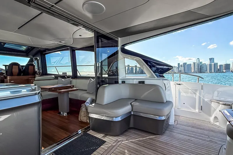 Slide: The Image of Luxurious 2026 Princess S65 Sportbridge yacht interior with city skyline view. - 17