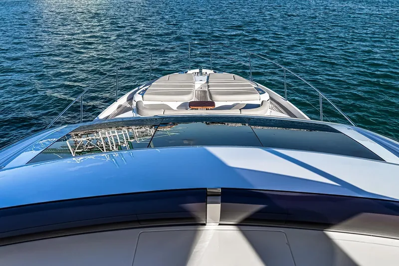 Slide: The Image of Luxurious 2026 Princess S65 Sportbridge yacht cruising on open water. - 74