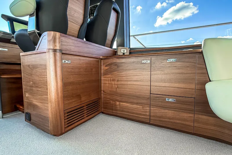 Slide: The Image of Luxurious interior of 2026 Princess S65 Sportbridge yacht with elegant wood cabinetry. - 38