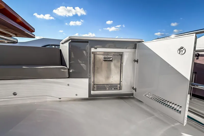 Slide: The Image of Luxurious 2026 Princess S65 Sportbridge yacht interior with sleek seating and storage. - 90