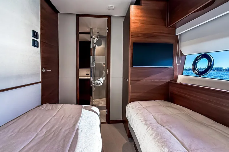 Slide: The Image of Luxurious interior of 2026 Princess S65 Sportbridge yacht with twin beds and modern amenities. - 62