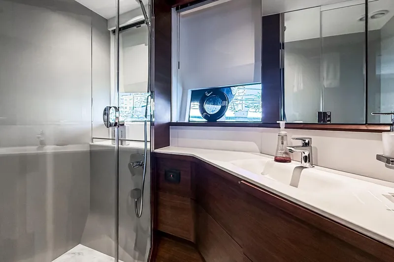 Slide: The Image of Luxurious bathroom in 2026 Princess S65 Sportbridge yacht with modern fixtures and sleek design. - 58