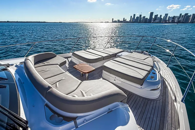 Slide: The Image of Luxurious 2026 Princess S65 Sportbridge yacht deck with city skyline view. - 80