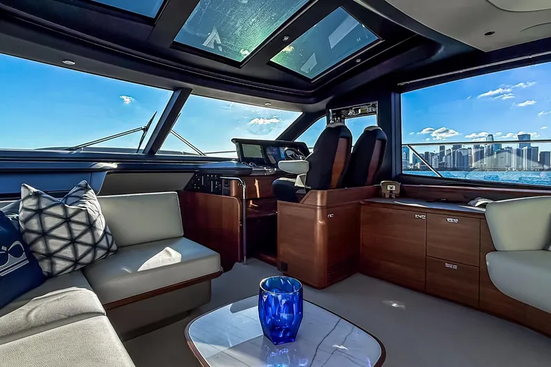 Slide: The Image of Luxurious interior of 2026 Princess S65 Sportbridge yacht with city skyline view. - 30