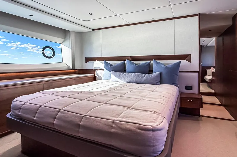 Slide: The Image of Luxurious bedroom interior of 2026 Princess S65 Sportbridge yacht with ocean view. - 46