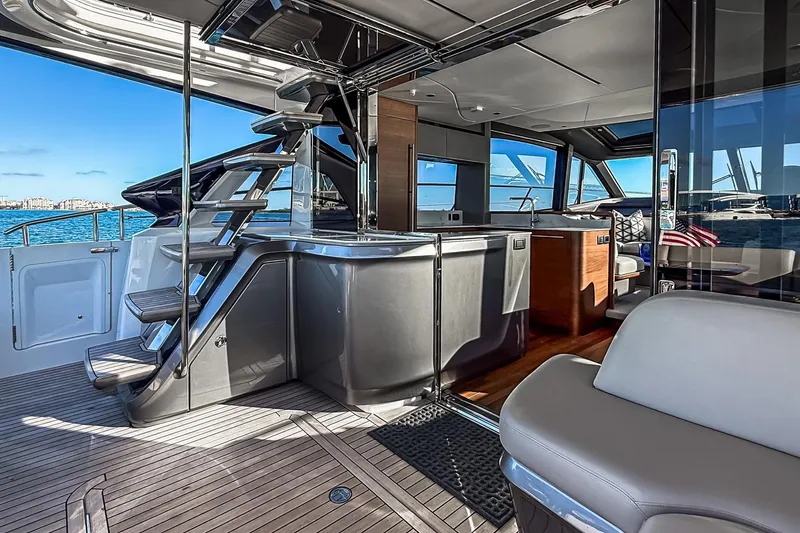 Slide: The Image of Luxurious 2026 Princess S65 Sportbridge yacht interior with modern design and ocean view. - 18