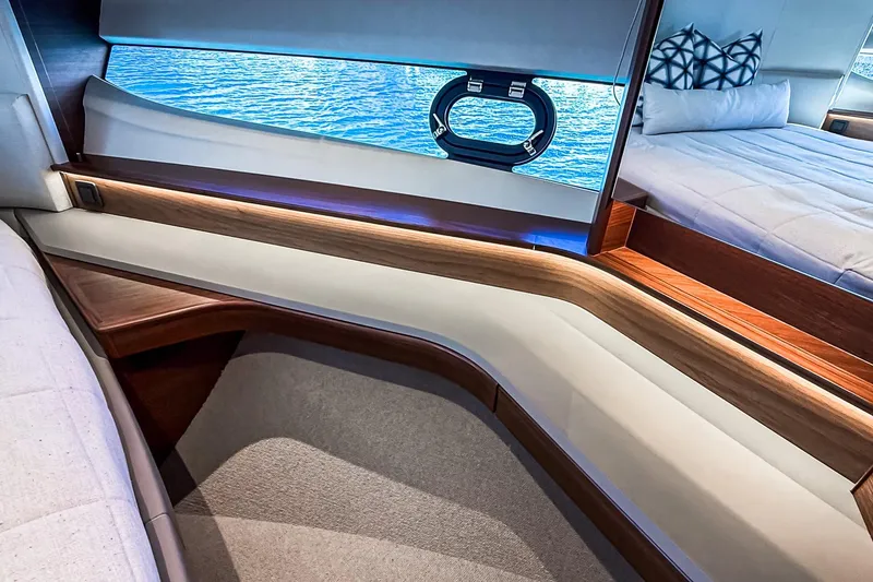 Slide: The Image of Luxurious interior of 2026 Princess S65 Sportbridge yacht with elegant wood finishes and ocean view. - 56