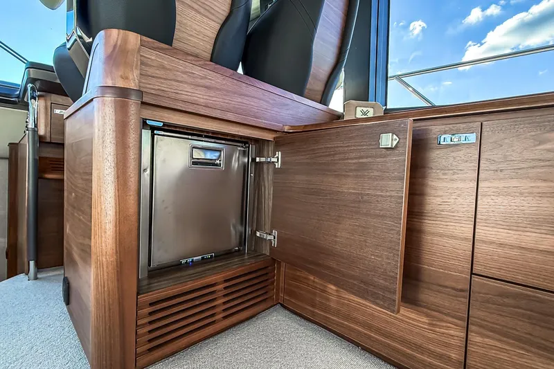 Slide: The Image of Luxurious interior of 2026 Princess S65 Sportbridge yacht with elegant wood cabinetry. - 39