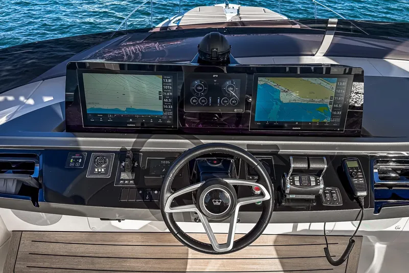 Slide: The Image of 2026 Princess S65 Sportbridge yacht helm with advanced navigation displays and controls. - 96