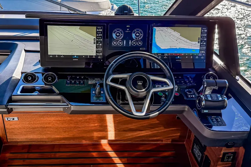 Slide: The Image of Helm of 2026 Princess S65 Sportbridge yacht with advanced navigation displays and controls. - 34