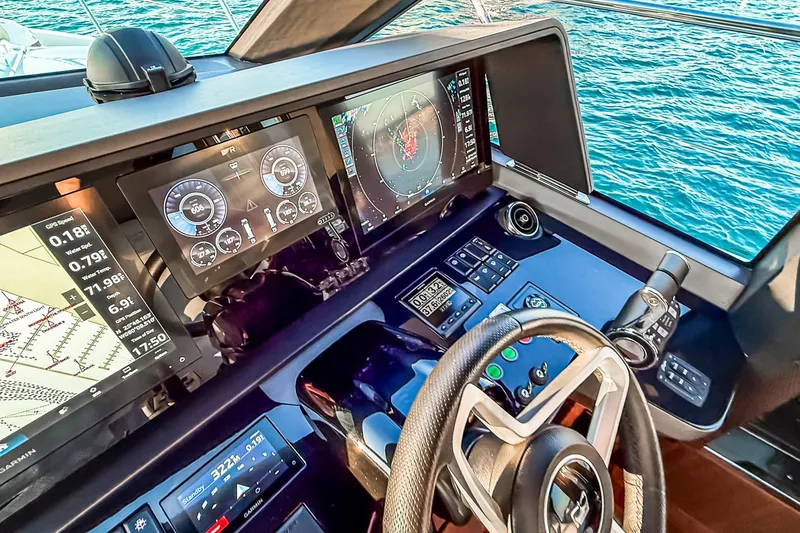 Slide: The Image of Helm of 2026 Princess S65 Sportbridge yacht with advanced navigation displays. - 98