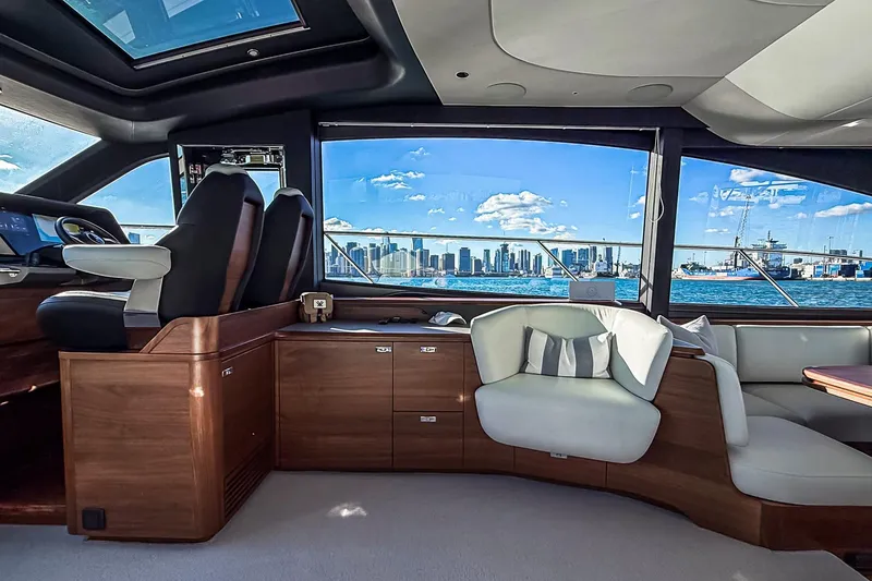 Slide: The Image of Luxurious interior of 2026 Princess S65 Sportbridge yacht with city skyline view. - 37