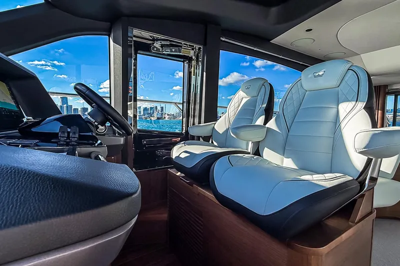 Slide: The Image of Luxurious interior of 2026 Princess S65 Sportbridge yacht with plush seating and scenic ocean view. - 31