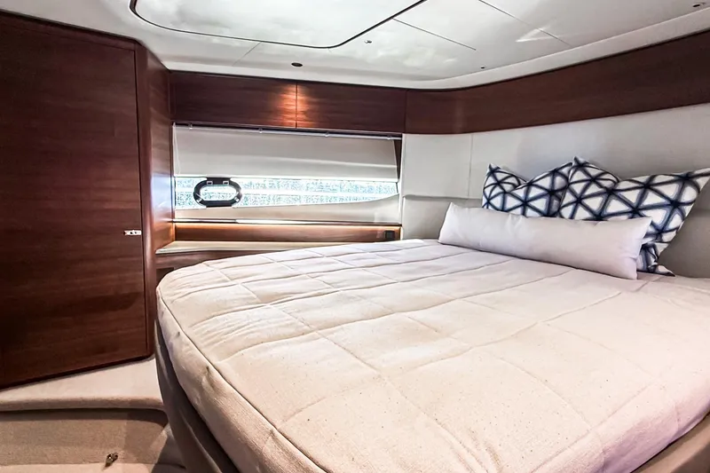 Slide: The Image of Luxurious bedroom interior of 2026 Princess S65 Sportbridge yacht with elegant bedding. - 54