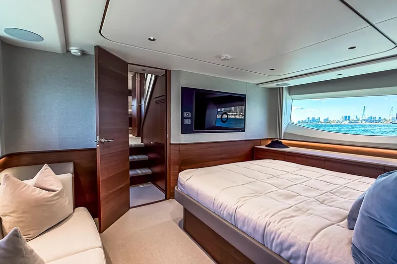 Slide: The Image of Luxurious interior of 2026 Princess S65 Sportbridge yacht with cityscape view. - 63