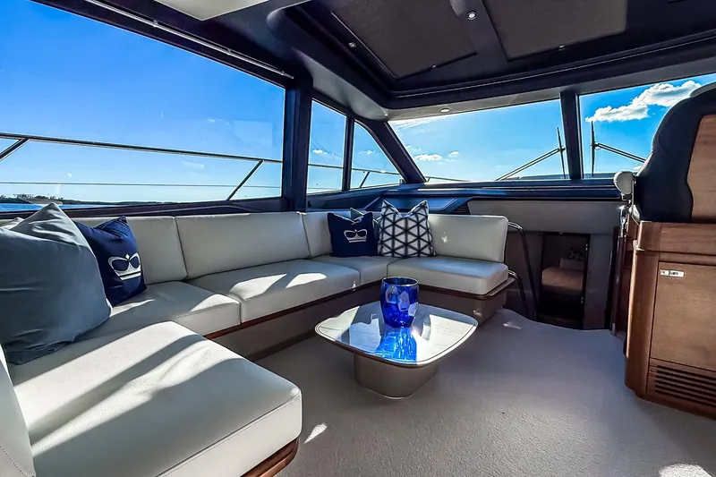 Slide: The Image of Luxurious interior of 2026 Princess S65 Sportbridge yacht with elegant seating and scenic views. - 27