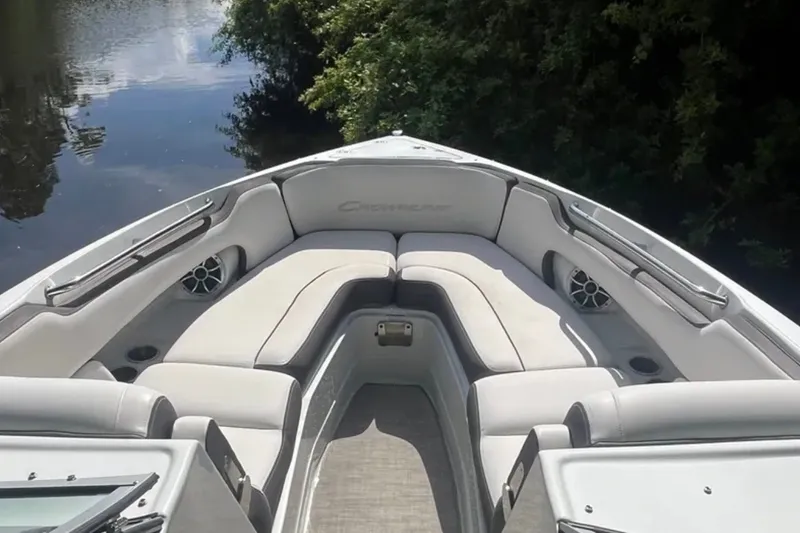 Slide: The Image of 2022 Crownline 290 XSS boat interior with plush seating and sleek design. - 6
