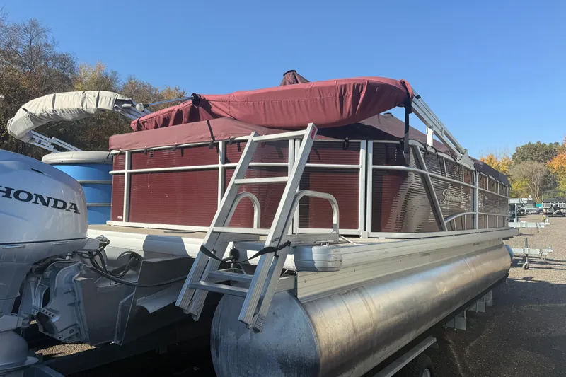 The Image of 2018 Sweetwater 22 pontoon boat with Honda motor, parked outdoors. - 0