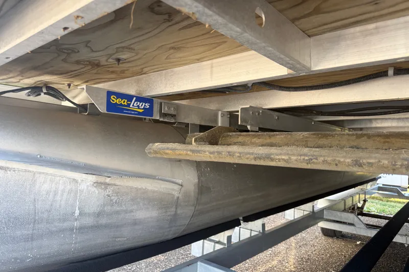 Slide: The Image of Underneath view of a 2018 Sweetwater 22 pontoon with Sea-Legs lift system. - 2