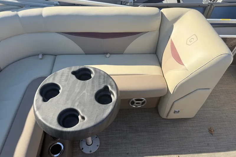 Slide: The Image of Luxurious seating area on a 2018 Sweetwater 22 pontoon boat with cup holders. - 13