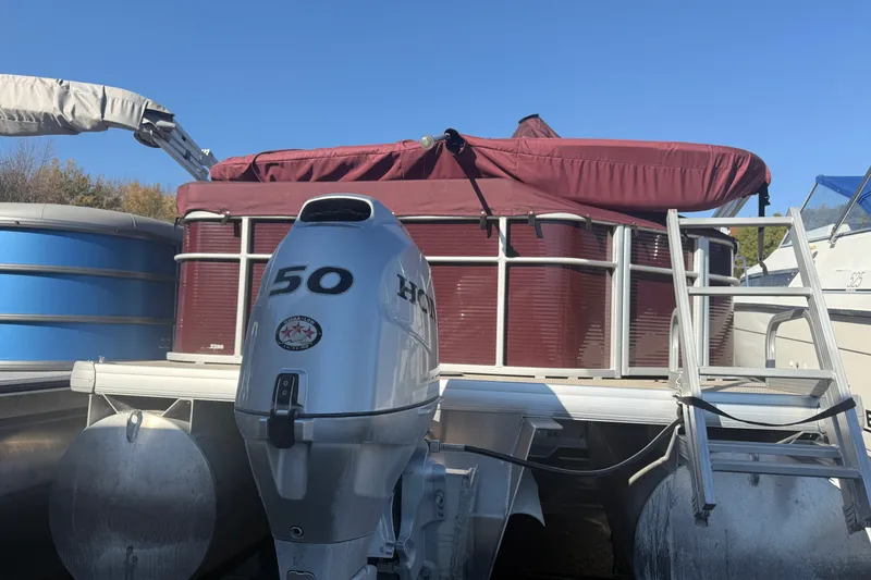 Slide: The Image of 2018 Sweetwater 22 pontoon boat with Honda 50 outboard motor, maroon cover. - 3