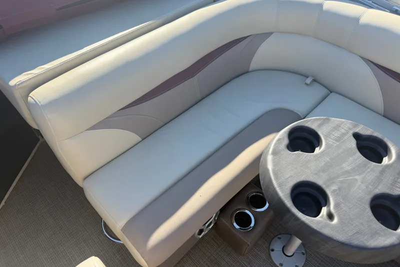 Slide: The Image of Luxurious seating area on a 2018 Sweetwater 22 boat with cup holders. - 14